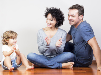 Happy family playing clapping
